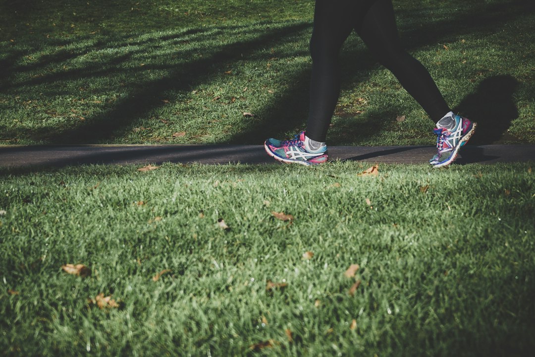 Person walking outdoors representing leg circulation and vein health